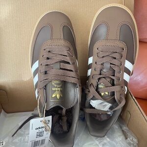 Adidas Brown and White Athletic Shoes with Signature Stripes